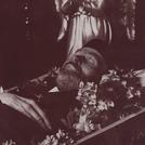 Man in fez with angel statue